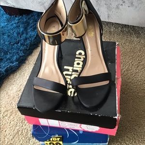 Black strappy heels with gold detail